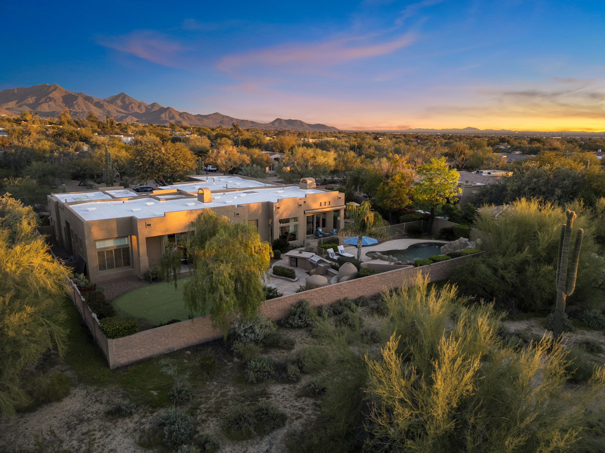 North Scottsdale golf community aerial view at twilight